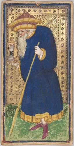 Illustration of a man in a blue robe with gold trim, holding a cane, against a gold-patterned background.