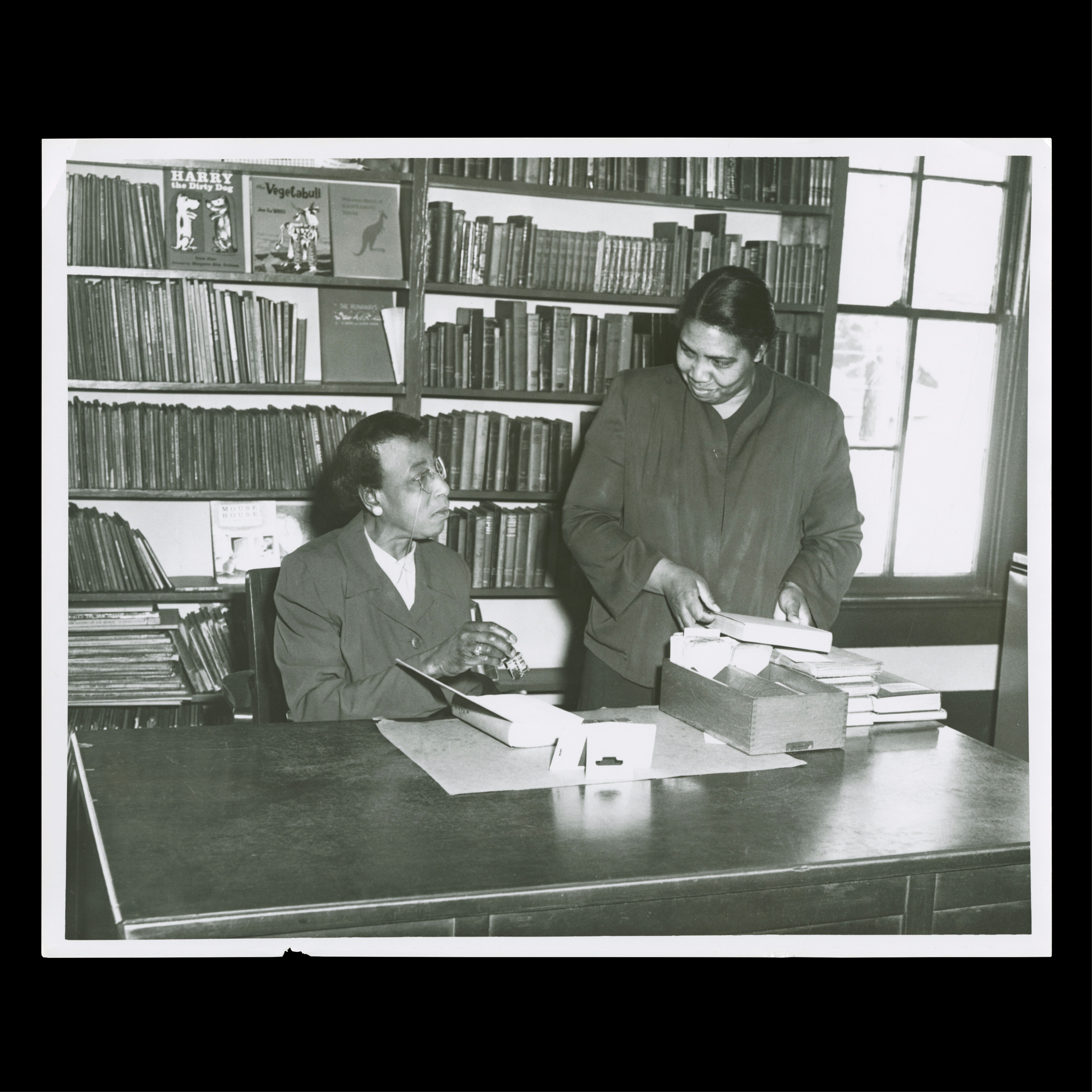 Photograph of Roxie Jarrell and Clara Hawkins, Dunbar Branch Library (Georgia, 1958). Athens-Clarke County Library.