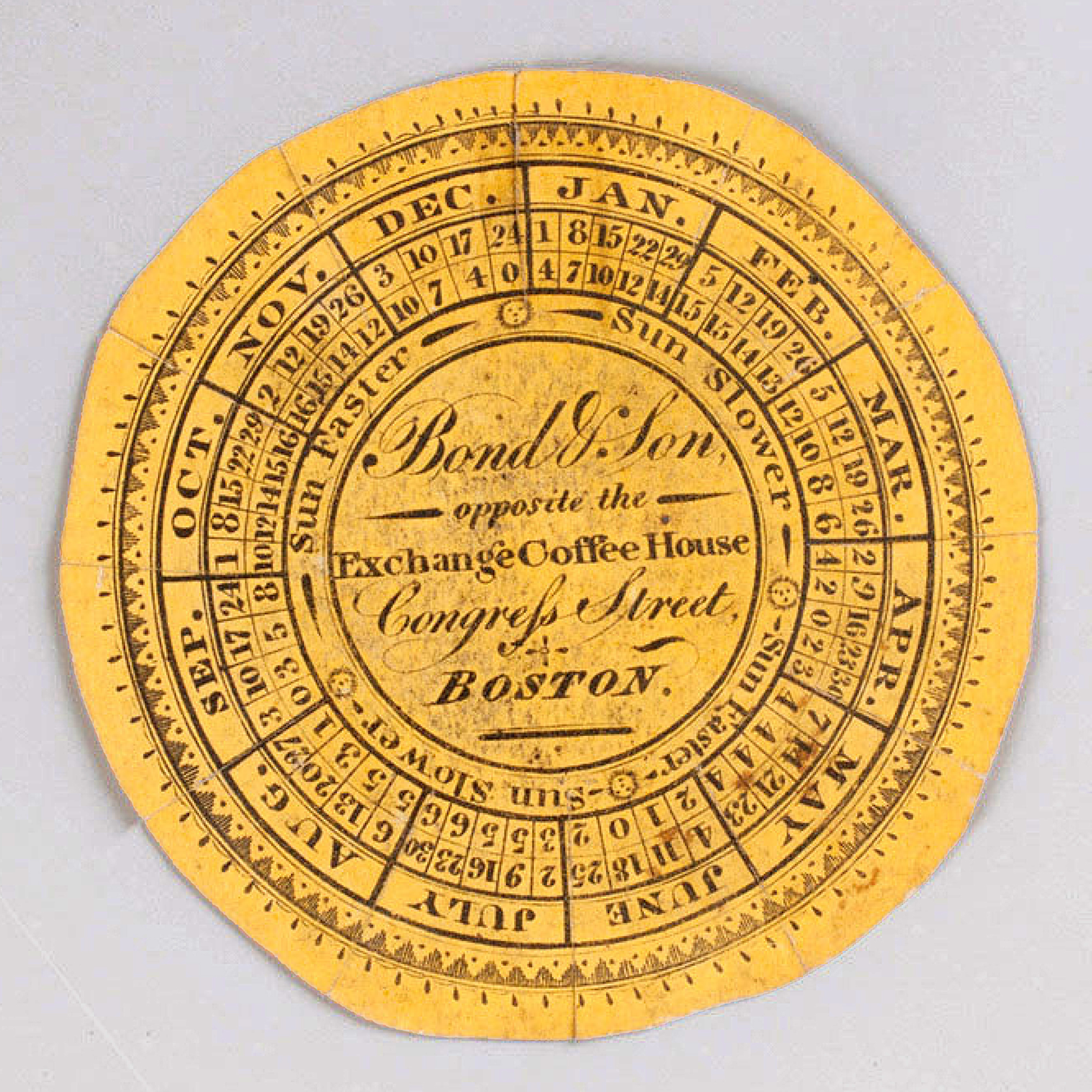 An engraved yellow watch paper, with the name of Bond & Son of Boston at the center.